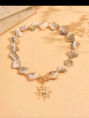 Gold Sun Charm Necklace with Iridescent Shell Beads